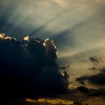 Cloudy sky with a ray of sunshine.