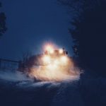 A snow plow at night.