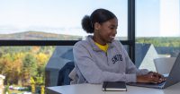 A student writing a short story for the 2020 Fall Fiction Contest.