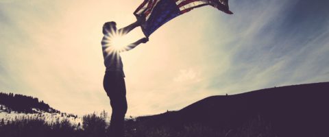Veteran holding US Flag