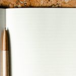Open notebook with pen