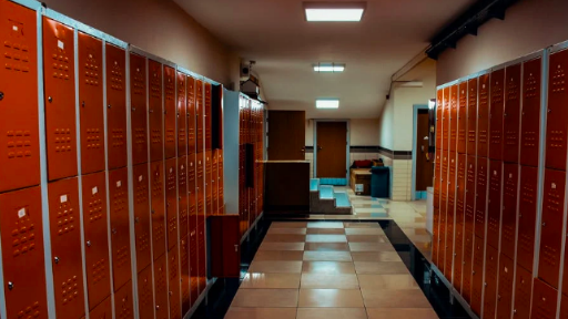 A High School hallway lined with red lockers