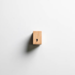 A small wooden piece with a comma.