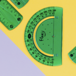 Green protractors and rulers on a yellow and gray background